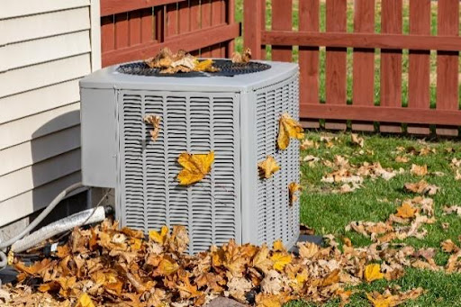 An outdoor air conditioner next to a residential home that requires proper maintenance from a skilled AC specialist in Powell, OH.